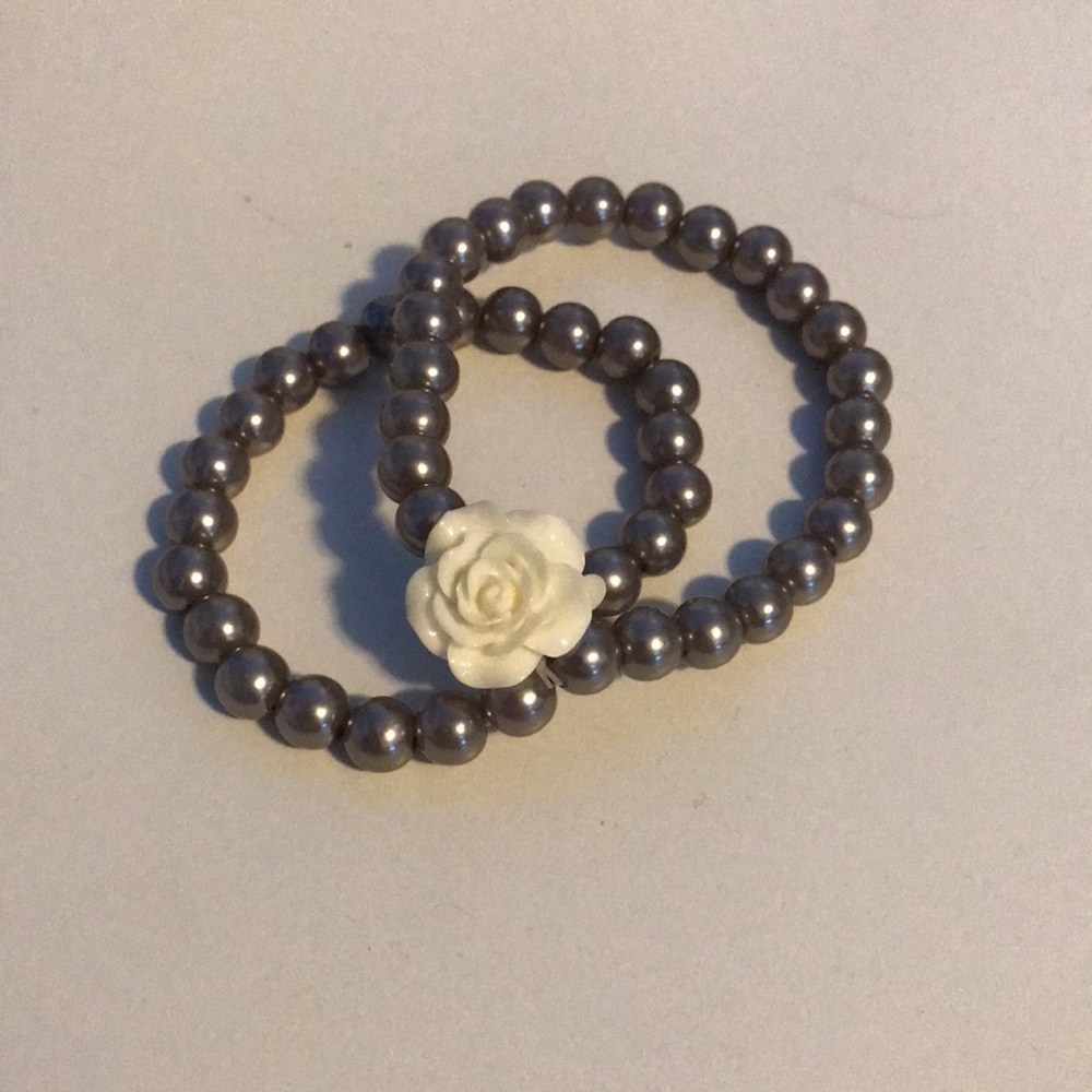 Silver bracelet with white flower
